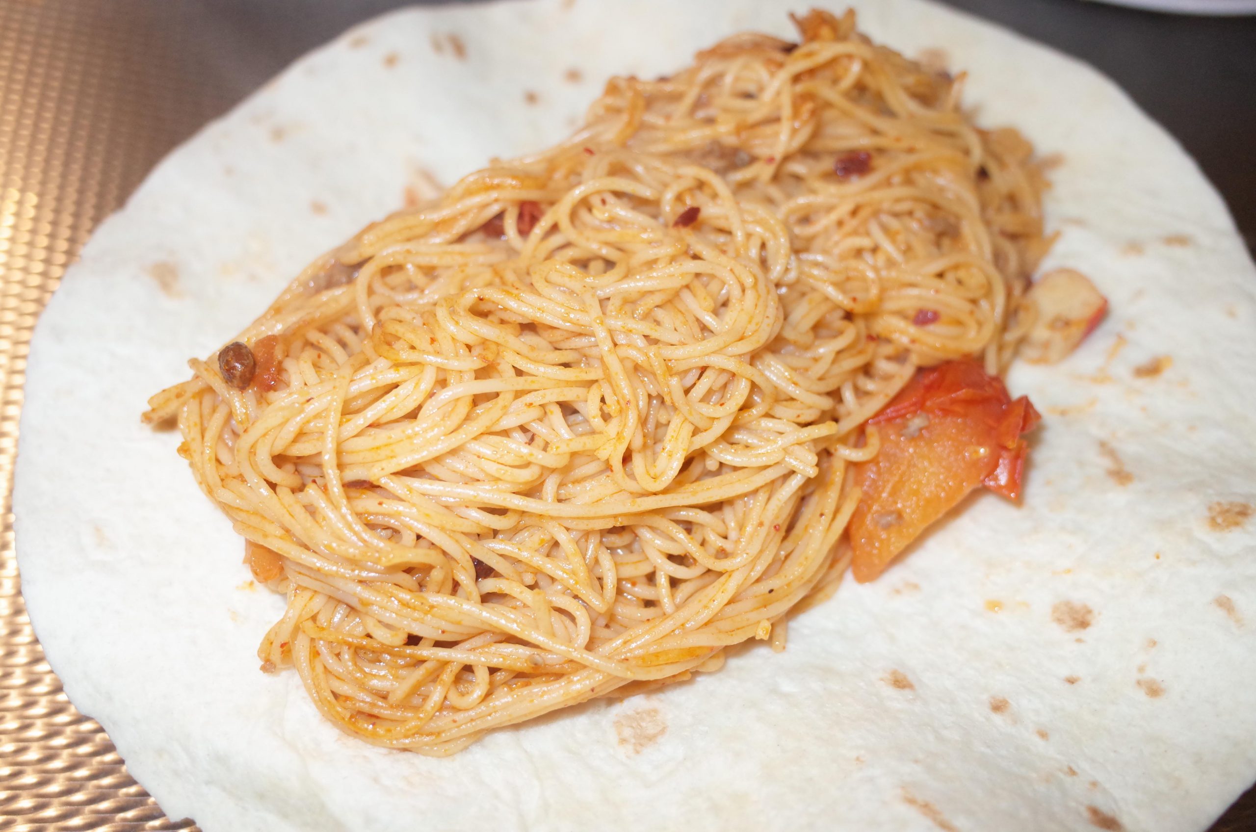 Spaghetti, tomatoes, tortilla, peanut